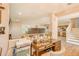 Bright home office area with a large desk, a nearby staircase, and easy access to the kitchen at 228 Star Shell Dr, Apollo Beach, FL 33572