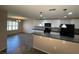 Open concept kitchen and dining area with updated appliances and light fixtures at 228 Star Shell Dr, Apollo Beach, FL 33572