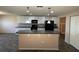 Open concept kitchen and dining area with updated appliances and light fixtures at 228 Star Shell Dr, Apollo Beach, FL 33572
