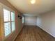 Spacious living room with attractive hardwood floors and plantation shutters, offering plenty of natural light at 228 Star Shell Dr, Apollo Beach, FL 33572