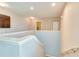 Bright loft features neutral paint, plush carpet, and an open layout perfect for relaxing or entertaining at 228 Star Shell Dr, Apollo Beach, FL 33572