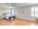 Large main bedroom with ceiling fan and hardwood flooring at 228 Star Shell Dr, Apollo Beach, FL 33572