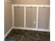 Functional mudroom area with hooks and decorative board and batten wall trim at 228 Star Shell Dr, Apollo Beach, FL 33572