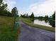 Picturesque walking path winding alongside a serene lake and lush greenery at 228 Star Shell Dr, Apollo Beach, FL 33572