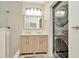 Modern bathroom with double vanity and stacked washer/dryer at 2866 15Th N Ave, St Petersburg, FL 33713