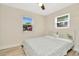 Well-lit bedroom with a double bed and two windows at 2866 15Th N Ave, St Petersburg, FL 33713