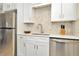 Modern kitchen with white shaker cabinets and stainless appliances at 2866 15Th N Ave, St Petersburg, FL 33713