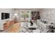Bright living room features hardwood floors, lots of decor, neutral colors, and doors to patio at 5306 Santa Rosa Ct # 342, Tampa, FL 33609