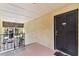Condo entry with private balcony and view of the building and landscaping at 5306 Santa Rosa Ct # 342, Tampa, FL 33609