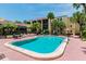 Community pool with plenty of lounge chairs and patio tables at 5306 Santa Rosa Ct # 342, Tampa, FL 33609