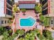 Complex features a kidney shaped swimming pool with surrounding patio furniture at 5306 Santa Rosa Ct # 342, Tampa, FL 33609