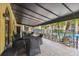 Covered patio with seating area near the pool at 5306 Santa Rosa Ct # 342, Tampa, FL 33609