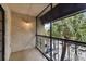 Spacious screened balcony overlooks the parking lot and features a metal railing at 5306 Santa Rosa Ct # 342, Tampa, FL 33609