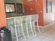 Small bar with three metal stools at 5306 Santa Rosa Ct # 342, Tampa, FL 33609