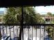 Balcony view overlooking a parking lot and lush tropical plants at 5306 Santa Rosa Ct # 342, Tampa, FL 33609