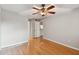 Hardwood floor bedroom with ceiling fan and access to hallway at 5306 Santa Rosa Ct # 342, Tampa, FL 33609