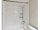 Clean bathroom with a shower/tub combo and tiled walls at 5306 Santa Rosa Ct # 342, Tampa, FL 33609