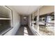 Enclosed front porch with tile flooring and windows at 17130 Pasco Acres Dr, Spring Hill, FL 34610