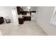 Simple kitchen with dark brown cabinets and white appliances at 17130 Pasco Acres Dr, Spring Hill, FL 34610