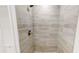 Large walk-in shower with neutral tone tile at 17130 Pasco Acres Dr, Spring Hill, FL 34610