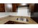 Modern kitchen features granite countertops and dark wood cabinets at 17130 Pasco Acres Dr, Spring Hill, FL 34610