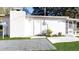 Single-story house exterior with a white facade at 17130 Pasco Acres Dr, Spring Hill, FL 34610