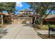 Two story home with three car garage and landscaping at 11140 Oyster Bay Cir, New Port Richey, FL 34654