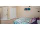 Bedroom with full-size bed and closet at 11140 Oyster Bay Cir, New Port Richey, FL 34654