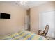 Bedroom with a rocking chair and built in closet at 11140 Oyster Bay Cir, New Port Richey, FL 34654