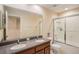 Bathroom with double sinks, tub, and shower at 11140 Oyster Bay Cir, New Port Richey, FL 34654