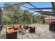 Relaxing screened patio with seating area, perfect for outdoor enjoyment at 11140 Oyster Bay Cir, New Port Richey, FL 34654