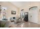 Bright living room with vaulted ceilings, comfy seating, and large windows at 11140 Oyster Bay Cir, New Port Richey, FL 34654