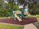 playground with modern equipment and safety surface at 11140 Oyster Bay Cir, New Port Richey, FL 34654
