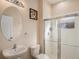 Clean bathroom with an oval mirror and a shower/tub combo at 11140 Oyster Bay Cir, New Port Richey, FL 34654