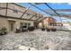 Large screened patio with built-in grill and plenty of space for entertaining at 11140 Oyster Bay Cir, New Port Richey, FL 34654