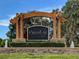 Waters Edge community entrance sign with landscaping and fountains at 11140 Oyster Bay Cir, New Port Richey, FL 34654