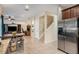 Open concept kitchen with stainless steel appliances and breakfast bar at 11140 Oyster Bay Cir, New Port Richey, FL 34654