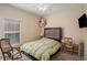 Cozy bedroom with a desk and window seat at 11140 Oyster Bay Cir, New Port Richey, FL 34654