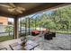 Spacious screened patio with furniture and lush green views at 11140 Oyster Bay Cir, New Port Richey, FL 34654