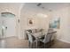 Elegant dining room with a mirrored table and gray velvet chairs at 11140 Oyster Bay Cir, New Port Richey, FL 34654