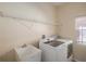 Laundry room with washer, dryer, and utility sink at 11140 Oyster Bay Cir, New Port Richey, FL 34654