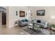 Spacious living room featuring plush sofas and a stylish coffee table at 11140 Oyster Bay Cir, New Port Richey, FL 34654