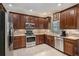 Modern kitchen with stainless steel appliances and granite countertops at 11140 Oyster Bay Cir, New Port Richey, FL 34654