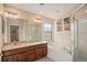 Bathroom with double sinks, garden tub, and shower at 11140 Oyster Bay Cir, New Port Richey, FL 34654