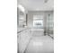 Modern bathroom with soaking tub, double vanity, and glass shower at 6120 Cezanne Ave, Lutz, FL 33558