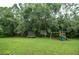 Spacious backyard with playset and trampoline at 6120 Cezanne Ave, Lutz, FL 33558