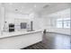 Large kitchen boasts white cabinets, marble countertops and stainless steel appliances at 6120 Cezanne Ave, Lutz, FL 33558