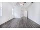 Spacious bedroom with hardwood floors and ceiling fan at 6120 Cezanne Ave, Lutz, FL 33558