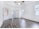 Bright and airy bedroom with hardwood floors and ceiling fan at 6120 Cezanne Ave, Lutz, FL 33558