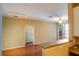 Living room with hardwood floors, access to kitchen and balcony at 4221 W Spruce St # 1310, Tampa, FL 33607